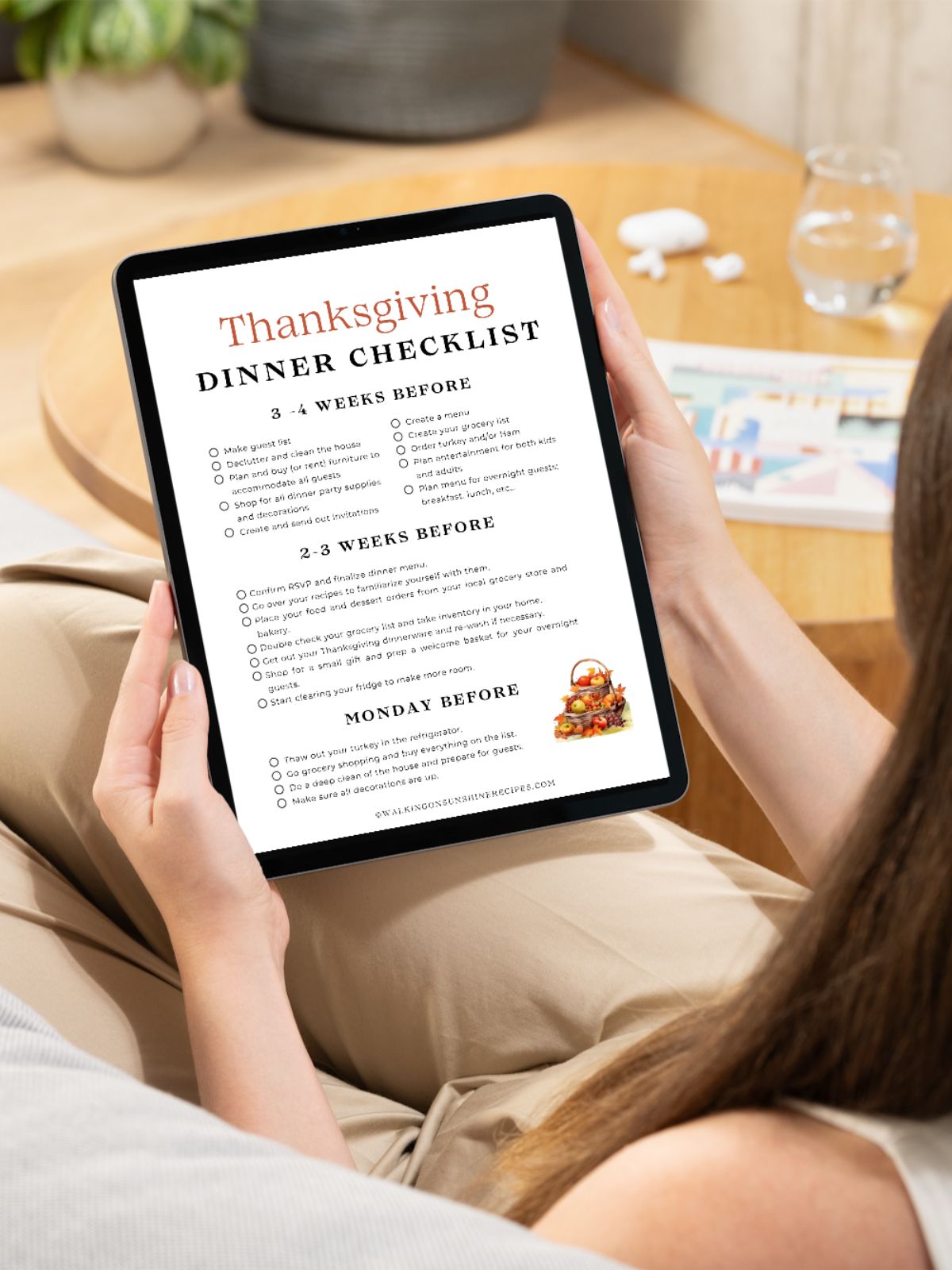 dinner checklist in tablet being held by girl.