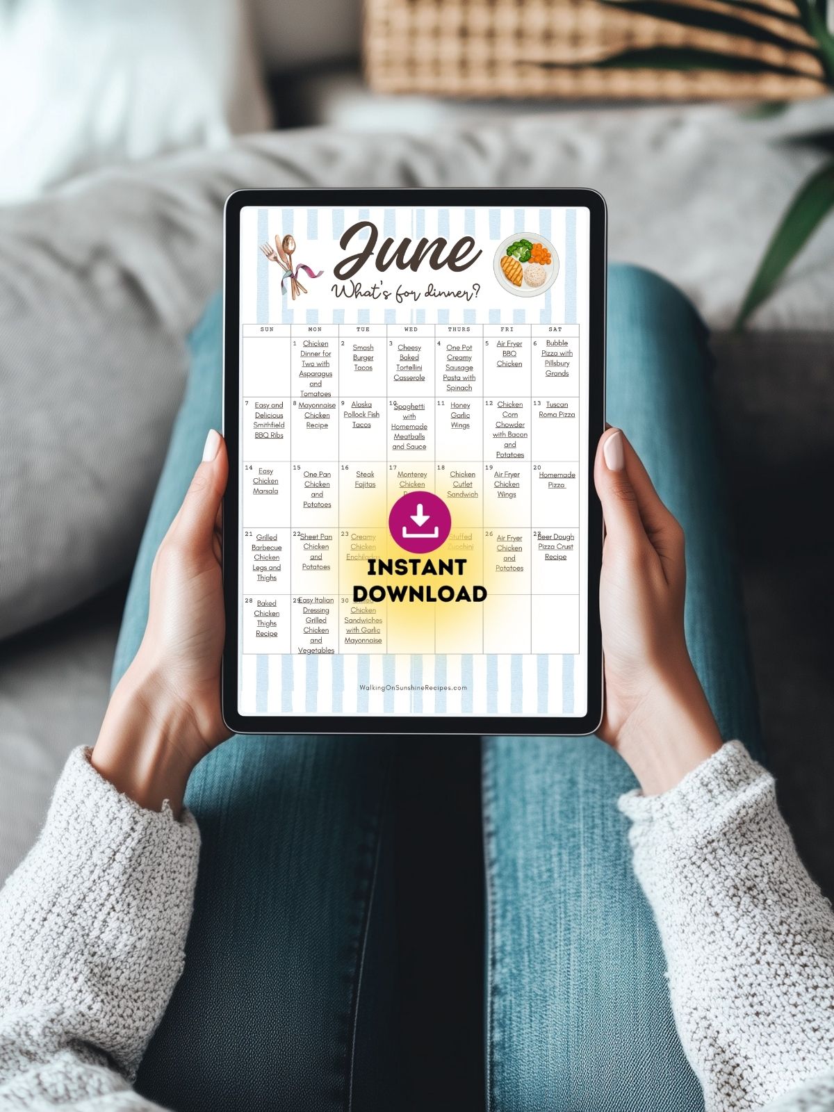 Person holding a tablet displaying the June meal plan calendar with 30 easy dinner recipes available as an instant download.